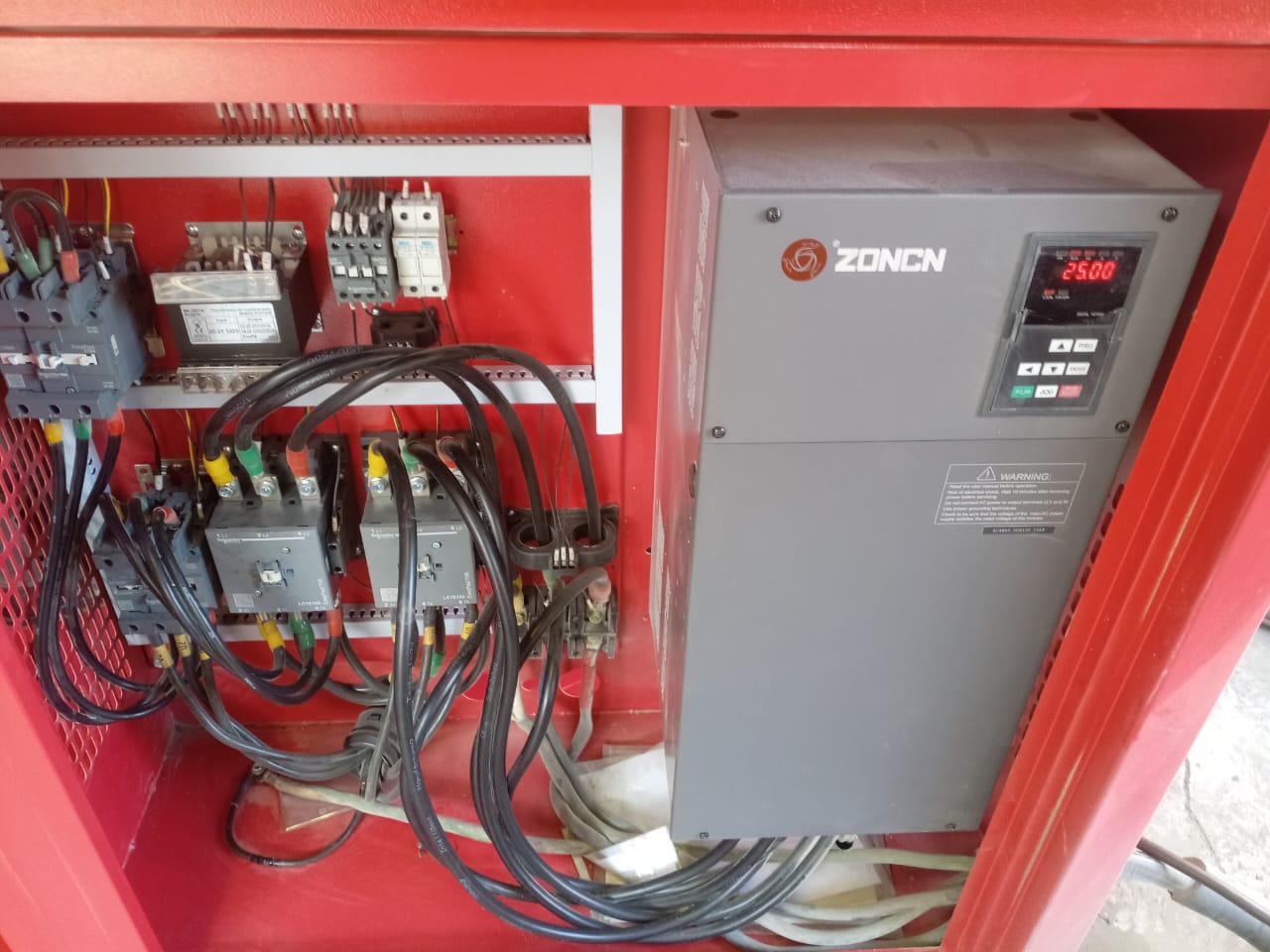 Close up of a technician servicing a Debon Air Compressor Generator
